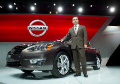 Nissan CEO Carlos Ghosn stands next to the 2013 Nissan Altima at the NYIAS.